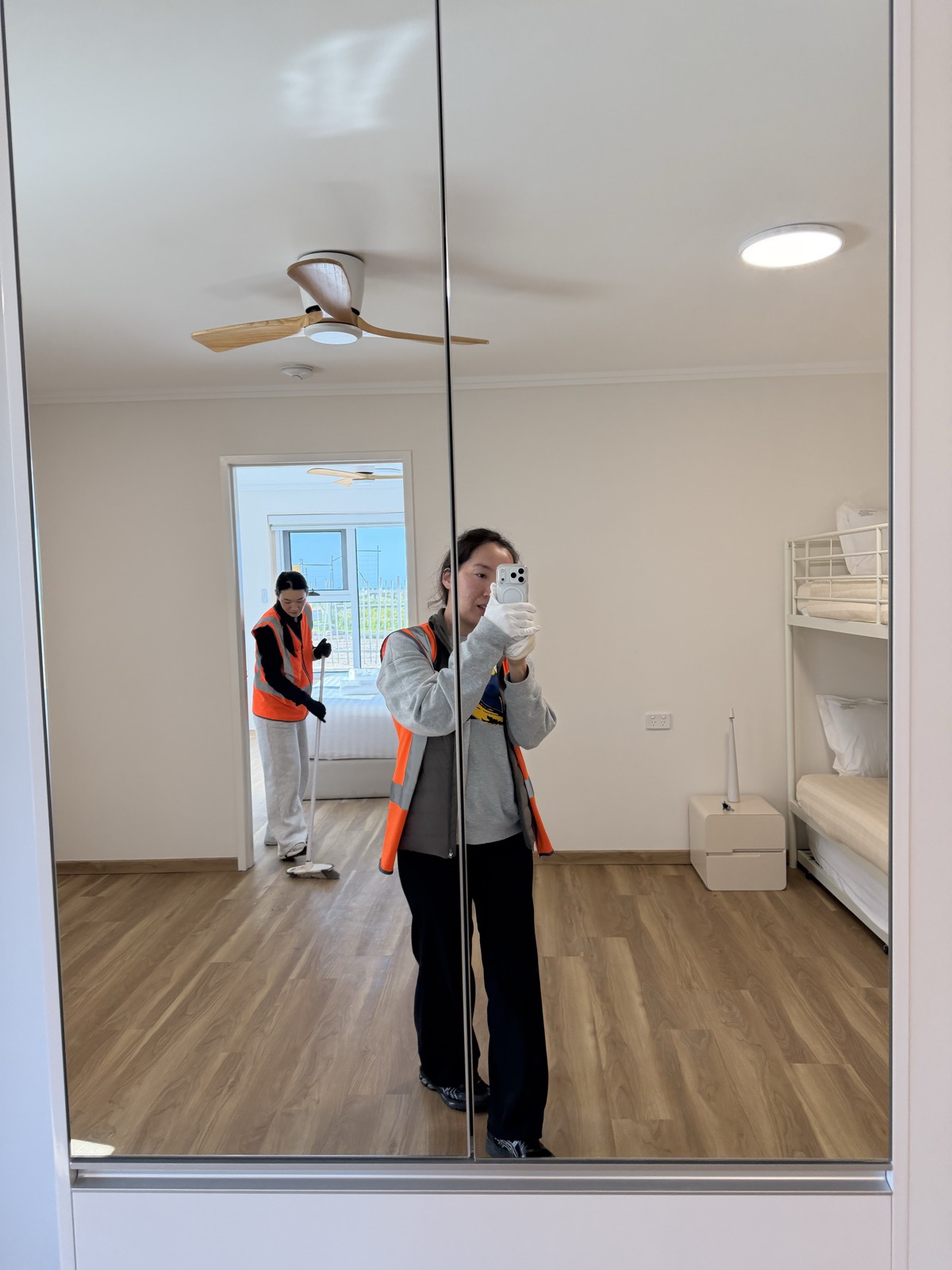 Togtuun cleaning crew in high-visibility vests completing a final clean of a newly built home