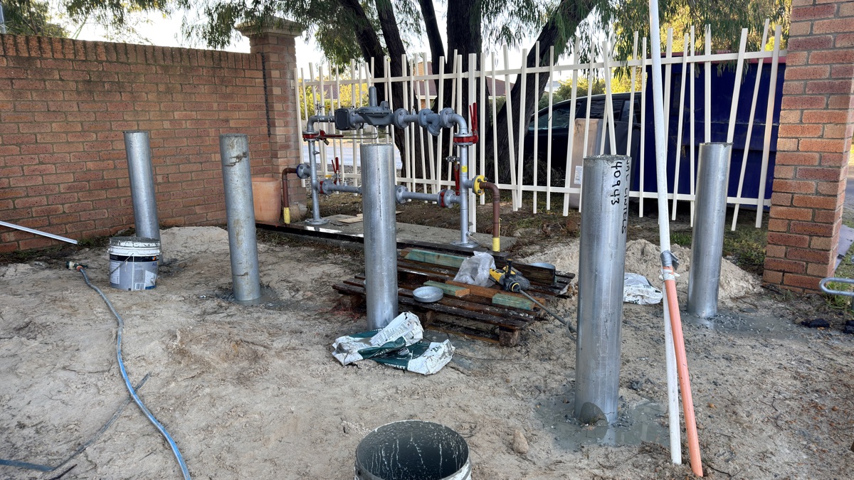Service pipe and post installation on a residential site