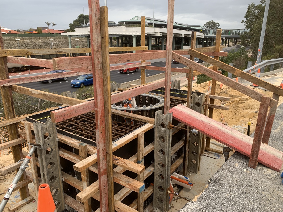 Formwork columns under construction beneath a tower crane on a Perth civil project